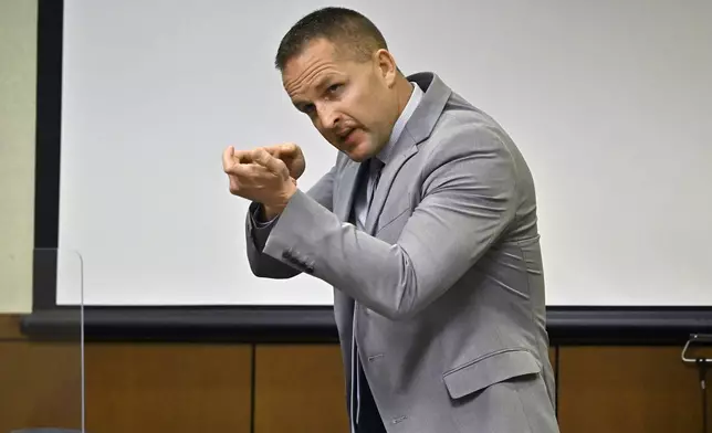 FILE - Former Louisville Police officer Brett Hankison describes what he saw in the apartment of Brionna Taylor during testimony, March 2, 2022, in Louisville, Ky. (AP Photo/Timothy D. Easley, Pool, file)