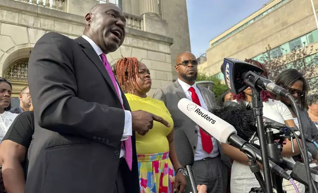 Attorney Ben Crump, left, stands beside Tamika Palmer, mother of Breonna Taylor, center; and Kenneth Walker, Taylor's boyfriend, center right, outside the federal courthouse in Louisville, Ky., Monday, July 21, 2025, after the sentencing of former Louisville Police officer Brett Hankinson in the raid that led to Taylor's death in 2020. (AP photo/Dylan T. Lovan)