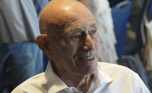 Harold Terens, a World War II veteran who fought in D-Day, speaks to friends during his 102 birthday party Saturday, July 26, 2025, in Delray Beach, Fla. (AP Photo/Marta Lavandier)