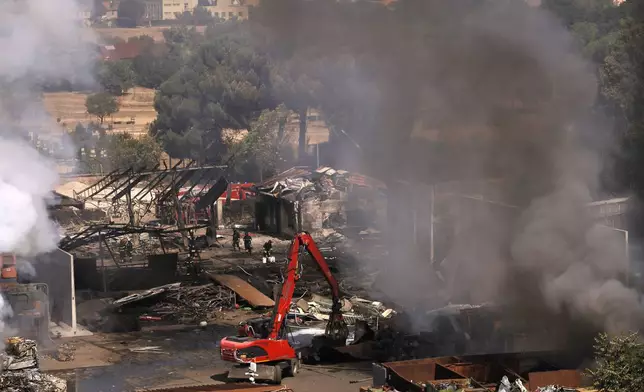 Firefighters at the scene of an explosion at a gas station in Rome, Italy, Friday, July 4, 2025. (Cecilia Fabiano/LaPresse via AP)
