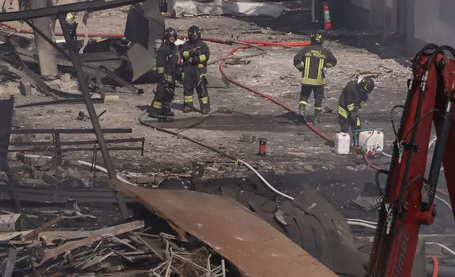Firefighters at the scene of an explosion at a gas station in Rome, Italy, Friday, July 4, 2025. (Cecilia Fabiano/LaPresse via AP)