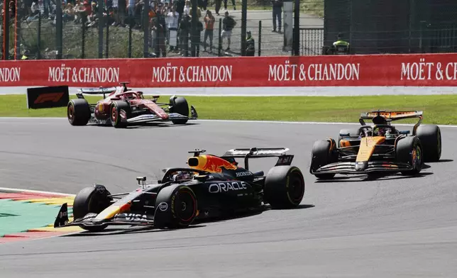 Red Bull driver Max Verstappen of the Netherlands, left, steers his car during the sprint race ahead of the Formula One Grand Prix at the Spa-Francorchamps racetrack in Spa, Belgium, Saturday, July 26, 2025. (AP Photo/Geert Vanden Wijngaert)