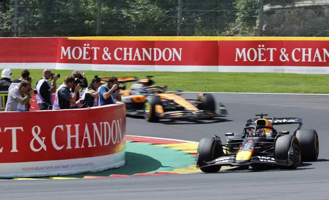 Red Bull driver Max Verstappen of the Netherlands, right, steers his car during the sprint race ahead of the Formula One Grand Prix at the Spa-Francorchamps racetrack in Spa, Belgium, Saturday, July 26, 2025. (AP Photo/Geert Vanden Wijngaert)