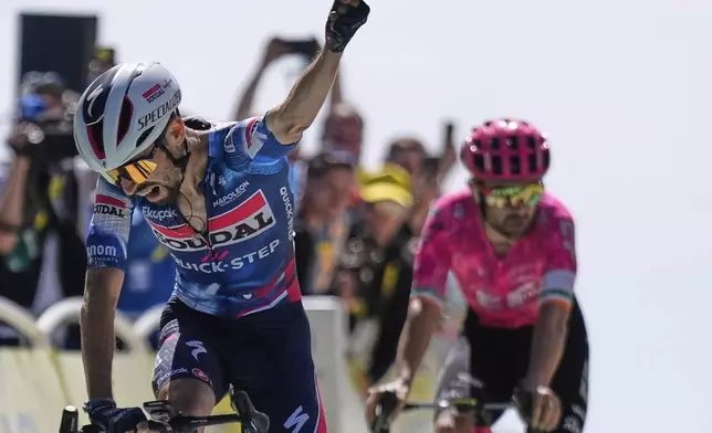France's Valentin Paret Peintre crosses the finish line ahead of Ireland's Ben Healy to win the sixteenth stage of the Tour de France cycling race over 171.5 kilometers (106.6 miles) with start in Montpellier and finish on the Mont Ventoux, France, Tuesday, July 22, 2025. (AP Photo/Mosa'ab Elshamy)