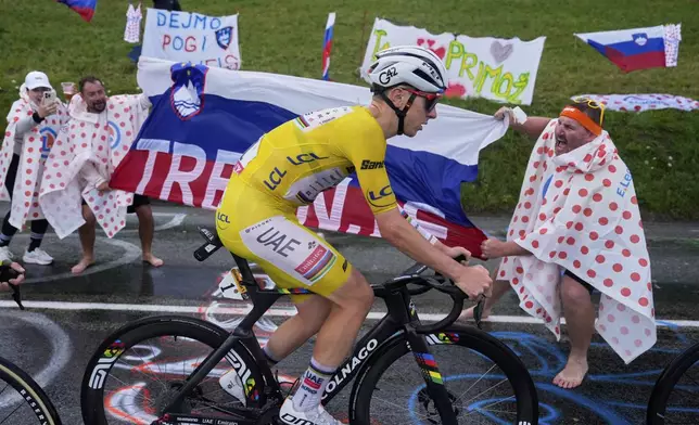Slovenia's Tadej Pogacar, wearing the overall leader's yellow jersey, climbs towards La Plagne during the nineteenth stage of the Tour de France cycling race over 93.1 kilometers (57.85 miles) with start in Albertville and finish in La Plagne, France, Friday, July 25, 2025. (AP Photo/Mosa'ab Elshamy)