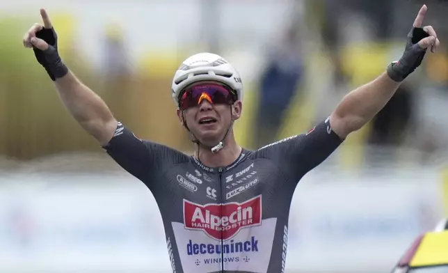 Australia's Kaden Groves crosses the finish line to win the twentieth stage of the Tour de France cycling race over 184.2 kilometers (114.5 miles) with start in Nantua and finish in Pontarlier, France, Saturday, July 26, 2025. (AP Photo/Mosa'ab Elshamy)