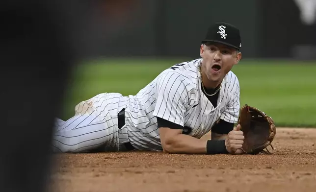 Chicago White Sox shortstop Colson Montgomery reacts after stopping a hit while diving and flipping the ball to second baseman Chase Meidroth to force out Toronto Blue Jays' Bo Bichette at second base during the fourth inning of a baseball game Monday, July 7, 2025, in Chicago. (AP Photo/Paul Beaty)