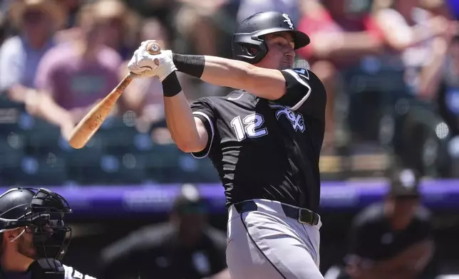 Chicago White Sox's Colson Montgomery singles against Colorado Rockies starting pitcher Chase Dollander in the second inning of a baseball game Sunday, July 6, 2025, in Denver. (AP Photo/David Zalubowski)