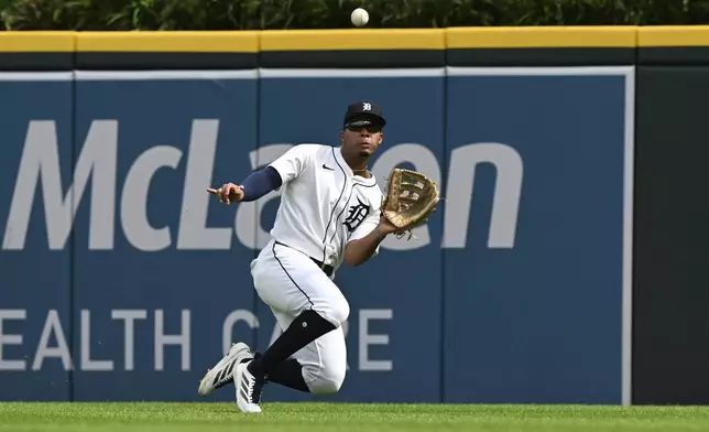 Detroit Tigers right fielder Wenceel Pérez (46) makes a sliding catch on a fly out hit by Seattle Mariners' Cole Young in the sixth inning of a baseball game, Saturday, July 12, 2025, in Detroit. (AP Photo/Lon Horwedel)