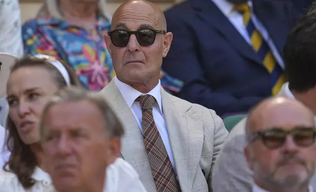 Actor Stanley Tucci sits in the Royal Box on Centre Court on day thirteen at the Wimbledon Tennis Championships in London, Saturday, July 12, 2025. (AP Photo/Kin Cheung)