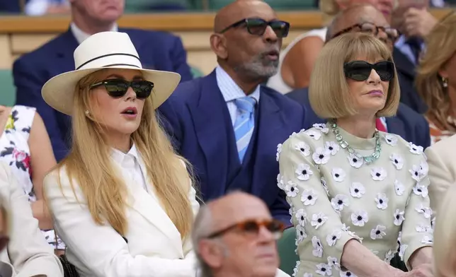 Anna Wintour, right, and actor Nicole Kidman sit in the Royal Box to watch Veronika Kudermetova of Russia and Elise Mertens of Belgium against Jelena Ostapenko of Latvia and Su-Weih Hsieh of Taiwan during the women's doubles final match at the Wimbledon Tennis Championships in London, Sunday, July 13, 2025.(AP Photo/Kirsty Wigglesworth)