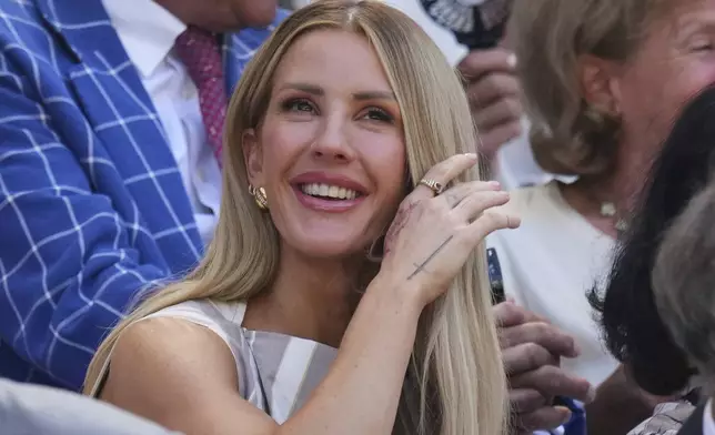 Singer Ellie Goulding sits in the Royal Box to watch Aryna Sabalenka of Belarus and Amanda Anisimova of the U.S. to play the women's singles semifinal match at the Wimbledon Tennis Championships in London, Thursday, July 10, 2025.(AP Photo/Kirsty Wigglesworth)