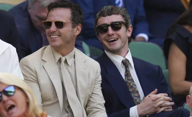 Actors Paul Mescal and Andrew Scott sit in the Royal Box to watch Veronika Kudermetova of Russia and Elise Mertens of Belgium against Jelena Ostapenko of Latvia and Su-Weih Hsieh of Taiwan during the women's doubles final match at the Wimbledon Tennis Championships in London, Sunday, July 13, 2025.(AP Photo/Kirsty Wigglesworth)