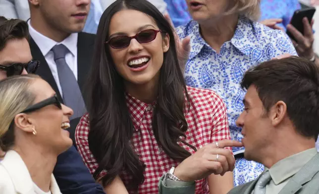 Singer Olivia Rodrigo smiles as she sits in the Royal Box at Centre Court during the Wimbledon Tennis Championships in London, Wednesday, July 2, 2025.(AP Photo/Kirsty Wigglesworth)