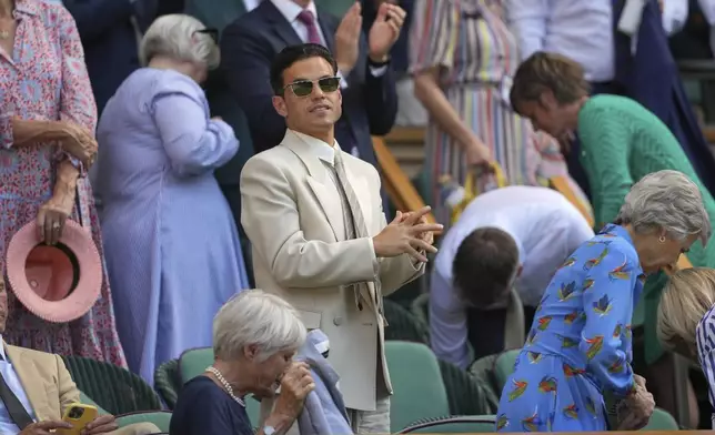 Actor Rami Malek applauds as he stands in the Royal Box on Centre Court on day twelve at the Wimbledon Tennis Championships in London, Friday, July 11, 2025. (AP Photo/Kin Cheung)