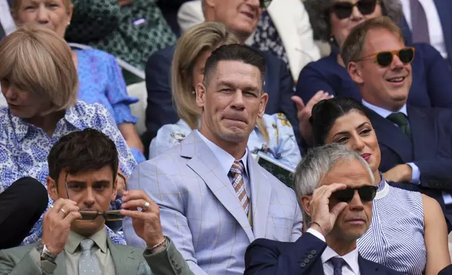 Wrestler John Cena sits in the Royal Box at Centre Court during the Wimbledon Tennis Championships in London, Wednesday, July 2, 2025.(AP Photo/Kirsty Wigglesworth)
