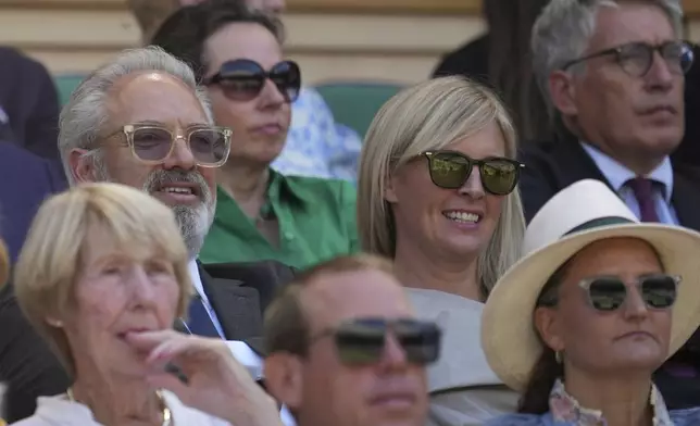 Film and stage director Sam Mendes and his wife Alison sit in the Royal Box on Centre Court on day thirteen at the Wimbledon Tennis Championships in London, Saturday, July 12, 2025. (AP Photo/Kin Cheung)