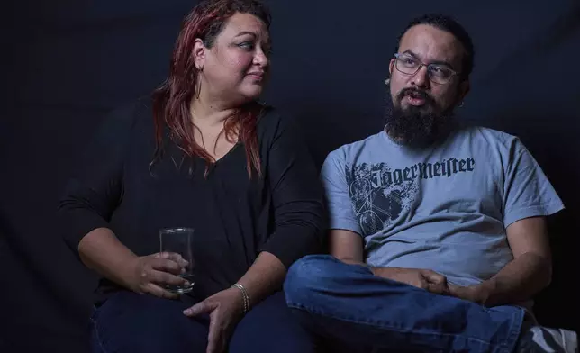 El Salvador journalist Monica Rodriguez, left, and her husband Steve Magaña, an activist, both of whom left the country fearing political persecution, give an interview on Friday, July 18, 2025. (AP Photo/Moises Castillo)