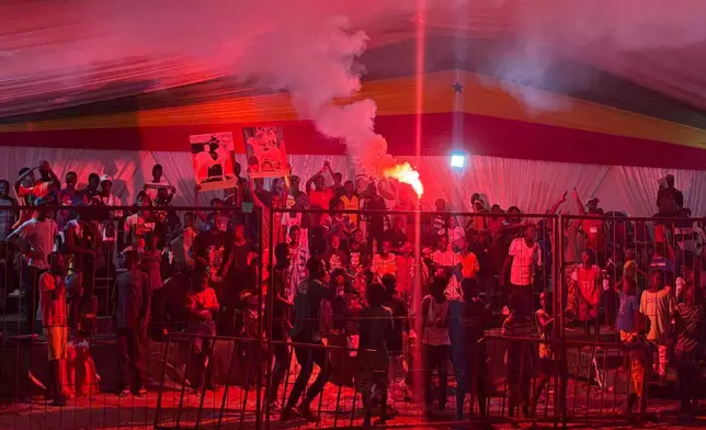 Fans cheer for their favorite sheep at the yearly Ladoum beauty pageant in Dakar, Senegal, Saturday, June 28, 2025. (AP Photo/Chinedu Asadu)