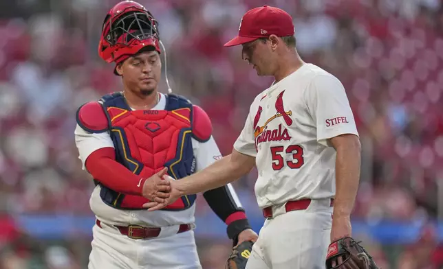 St. Louis Cardinals starting pitcher Andre Pallante (53) is congratulated by catcher Yohel Pozo after working the fifth inning of a baseball game against the Miami Marlins Monday, July 28, 2025, in St. Louis. (AP Photo/Jeff Roberson)