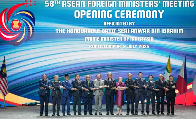 From left to right, East Timor Foreign Minister Bendito dos Santos Freitas, Lao Minister of Affairs Thongsavanh Phomvihane, Indonesia's Foreign Minister Sugiono, Cambodia's Foreign Minister Prak Sokhonn, Brunei's Minister of Foreign Affairs Erywan Yusof, Malaysia's Prime Minister Anwar Ibrahim, Malaysia's Foreign Affairs Minister Mohamad Hasan, Philippine Foreign Secretary Theresa Lazaro, Singapore's Foreign Minister Vivian Balakrishnan, Thailand's Foreign Minister Maris Sangiampongsa, Vietnam's Foreign Minister Bui Thanh Son, Myanmar Ministry of Foreign Affairs representative Kyaw Nyun Oo and ASEAN's Secretary-General Kao Kim Hourn pose for the group photo during the opening ceremony of the Association of Southeast Asian Nations (ASEAN) Foreign Ministers' meeting and related meetings at the Convention Centre in Kuala Lumpur, Malaysia, Wednesday, July 9, 2025. (AP Photo/Vincent Thian)