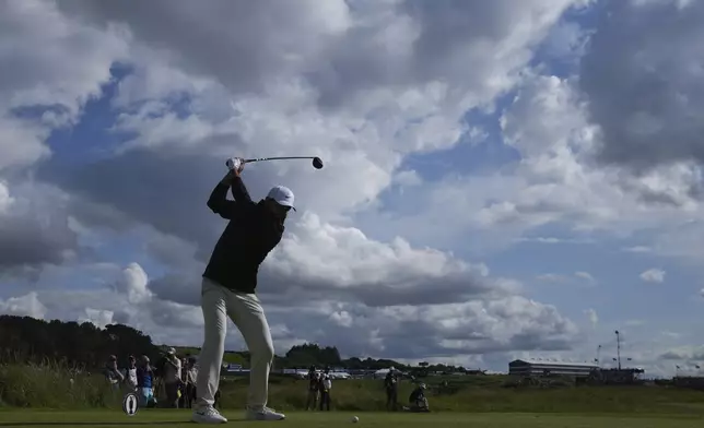Scottie Scheffler of the United States plays off the 9th tee during the third round of the British Open golf championship at the Royal Portrush Golf Club, Northern Ireland, Saturday, July 19, 2025. (AP Photo/Jon Super)