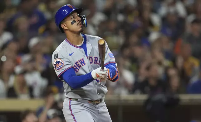 New York Mets' Mark Vientos watches his grand slam during the fifth inning of a baseball game against the San Diego Padres Monday, July 28, 2025, in San Diego. (AP Photo/Gregory Bull)