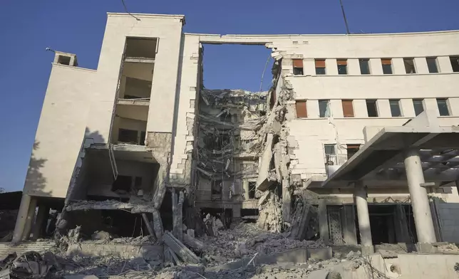 The Syrian Defense Ministry building sits heavily damaged after alleged Israeli airstrikes in Damascus, Syria, Wednesday, July 16, 2025. (AP Photo/Ghaith Alsayed)