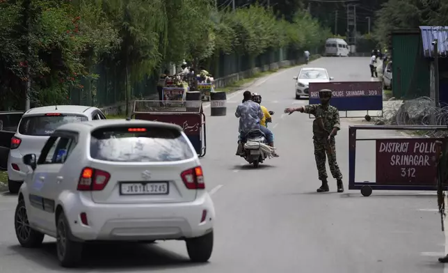 An Indian soldier guards at a check point near the site of a gun battle on the outskirts of Srinagar, Indian controlled Kashmir, Monday, July 28, 2025.(AP Photo/Mukhtar Khan)