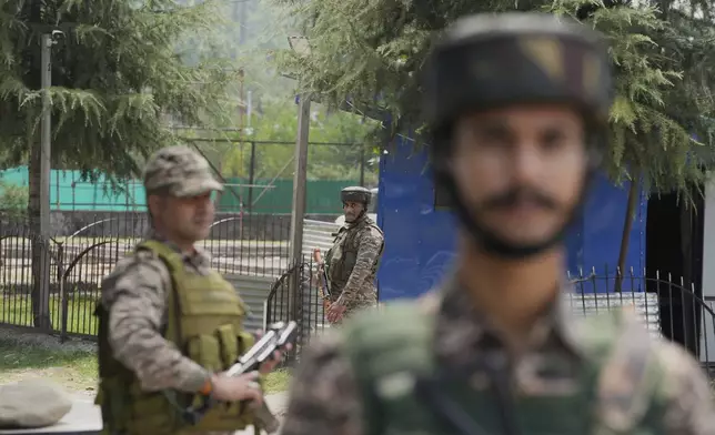 Indian soldiers guard at a check point near the site of a gun battle on the outskirts of Srinagar, Indian controlled Kashmir, Monday, July 28, 2025.(AP Photo/Mukhtar Khan)
