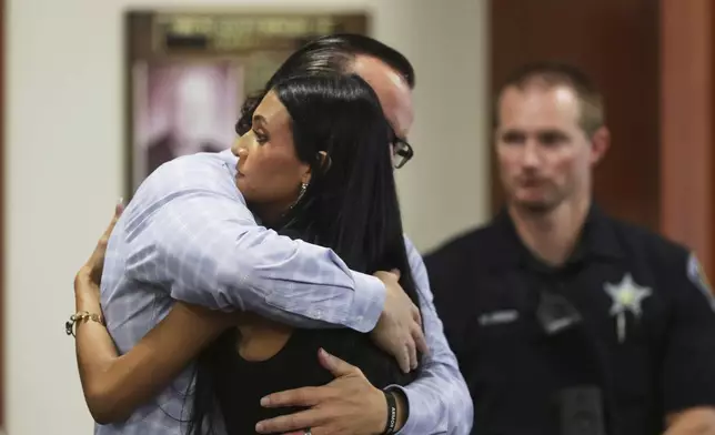 CORRECTS SPELLING OF ALIVEA - Steve Goncalves, father of victim Kaylee Goncalves hugs his daughter Alivea after speaking at the sentencing hearing of Bryan Kohberger at the Ada County Courthouse, Wednesday, July 23, 2025, in Boise, Idaho, for brutally stabbing four University of Idaho students to death nearly three years ago. (AP Photo/Kyle Green, Pool)