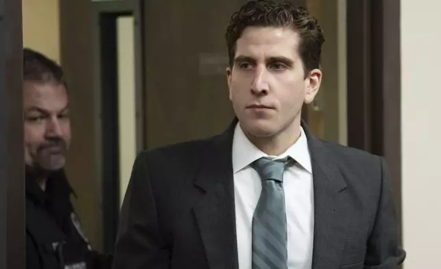 FILE - Bryan Kohberger, right, is escorted into a courtroom for a hearing in Latah County District Court, Sept. 13, 2023, in Moscow, Idaho. (AP Photo/Ted S. Warren, Pool, File)