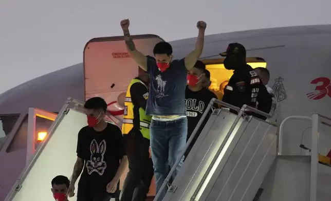 Migrants deported months ago by the United States to El Salvador under the Trump administration's immigration crackdown arrive at Simon Bolívar International Airport in Maiquetia, Venezuela, Friday, July 18, 2025. (AP Photo/Ariana Cubillos)