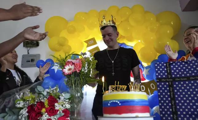 Andry Hernandez, a Venezuelan migrant deported months ago to El Salvador by the United States under an immigration crackdown, is welcomed home in Capacho Nuevo, Venezuela, Wednesday, July 23, 2025. (AP Photo/Ariana Cubillos)