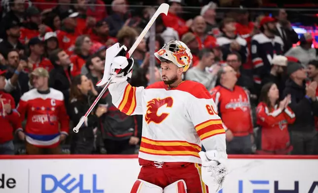 FILE - Calgary Flames goaltender Dan Vladar (80) looks on during the first period of an NHL hockey game against the Washington Capitals, Feb. 25, 2025, in Washington. (AP Photo/Nick Wass, File)