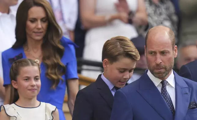 Britain's Prince William, right, Kate, Princess of Wales, rear,Prince George and Princess Charlotte arrive to watch Jannik Sinner of Italy and Carlos Alcaraz of Spain during their men's singles final match at the Wimbledon Tennis Championships in London, Sunday, July 13, 2025.(AP Photo/Kirsty Wigglesworth)