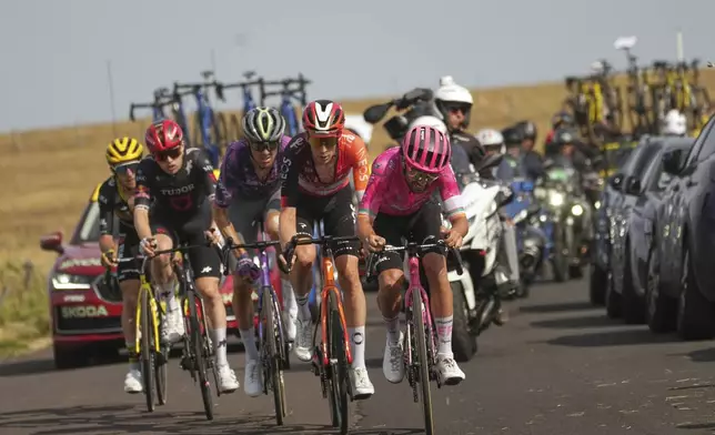 Ireland's Ben Healy leads the breakaway with Netherlands' Thymen Arensman, Australia's Ben O'Connor, Australia's Michael Storer, and Britain's Simon Yates, from right to left, during the tenth stage of the Tour de France cycling race over 165.3 kilometers (102.7 miles) with start in Ennezat and finish in Le Mont-Dore Puy de Sancy, France, Monday, July 14, 2025. (AP Photo/Thibault Camus)