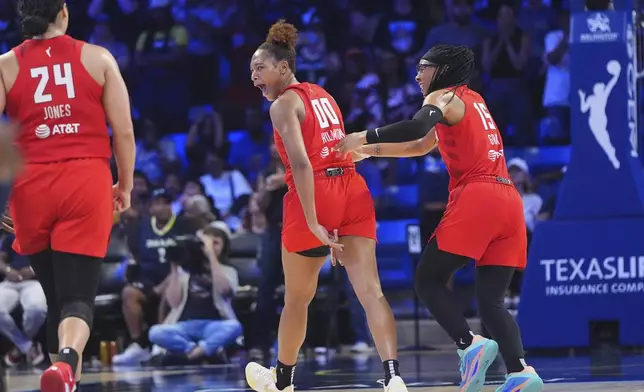 Atlanta Dream forward Naz Hillmon (00) celebrates hitting a game winning shot with teammates guard Allisha Gray (15) and forward Brionna Jones (24) during the second half of a WNBA basketball game against the Dallas Wings in Arlington, Texas, Wednesday, July 30, 2025. (AP Photo/LM Otero)
