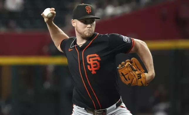 San Francisco Giants pitcher Landen Roupp throws against the Arizona Diamondbacks in the first inning during a baseball game, Wednesday, July 2, 2025, in Phoenix. (AP Photo/Rick Scuteri)