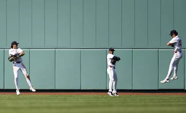 Boston Red Sox's Jarren Duran, left, center fielder Ceddanne Rafaela and right fielder Roman Anthony celebrate defeating the Tampa Bay Rays in a baseball game, Sunday, July 13, 2025, in Boston. (AP Photo/Greg M. Cooper)