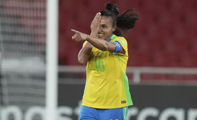 Brazil's Marta celebrates scoring her side's third goal, from the penalty spot, during a Women's Copa America soccer semifinal against Uruguay at Rodrigo Paz Delgado stadium in Quito, Ecuador, Tuesday, July 29, 2025. (AP Photo/Dolores Ochoa)