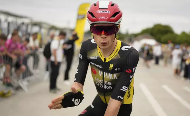 Denmark's Jonas Vingegaard waves prior to the start of the first stage of the Tour de France cycling race over 184.9 kilometers (114.9 miles) with start and finish in Lille, France, Saturday, July 5, 2025. (AP Photo/Mosa'ab Elshamy)