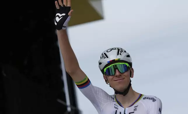 Slovenia's Tadej Pogacar waves prior to the start of the first stage of the Tour de France cycling race over 184.9 kilometers (114.9 miles) with start and finish in Lille, France, Saturday, July 5, 2025. (AP Photo/Mosa'ab Elshamy)