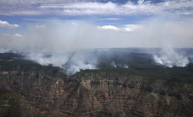 The Dragon Bravo Fire continues to burn on the Grand Canyon's north rim Saturday, July 19, 2025. (Joe Rondone/The Arizona Republic via AP, Pool)
