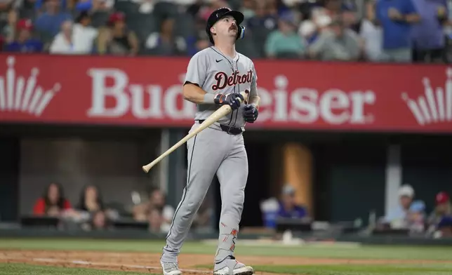 Detroit Tigers catcher Jake Rogers reacts after lining out in the fifth inning of a baseball game against the Texas Rangers, Saturday, July 19, 2025, in Arlington, Texas. (AP Photo/Tony Gutierrez)