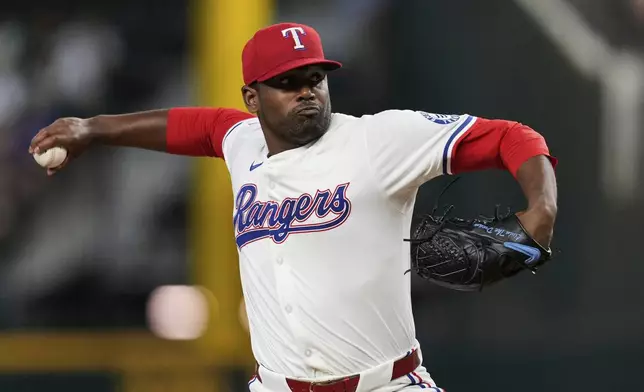 Texas Rangers starting pitcher Kumar Rocker throws to the Detroit Tigers in the first inning of a baseball game, Saturday, July 19, 2025, in Arlington, Texas. (AP Photo/Tony Gutierrez)