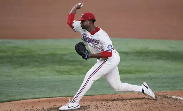 Texas Rangers starting pitcher Kumar Rocker throws to the Detroit Tigers in the fourth inning of a baseball game, Saturday, July 19, 2025, in Arlington, Texas. (AP Photo/Tony Gutierrez)