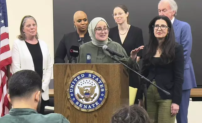 FILE - Tufts University student from Turkey, Rumeysa Ozturk, who was arrested by immigration agents while walking along a street in a Boston suburb, talks to reporters on arriving back in Boston, May 10, 2025, a day after she was released from a Louisiana immigration detention center on the orders of a federal judge. (AP Photo/Rodrique Ngowi, File)