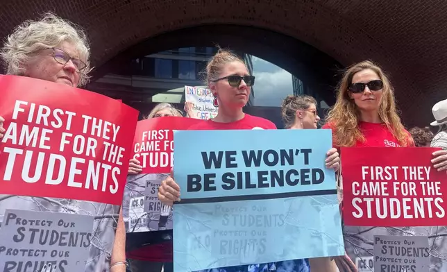 People show their support for a lawsuit challenging the Trump administration's policy of targeting students for deportation who took part in pro-Palestinian demonstrations on Monday, July 7, 2025, at the federal courthouse in Boston. (AP Photo/Michael Casey)