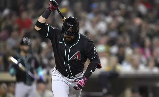 Arizona Diamondbacks' Eugenio Suarez slams his bat after flying out during the seventh inning of a baseball game against the San Diego Padres Thursday, July 10, 2025, in San Diego. (AP Photo/Orlando Ramirez)